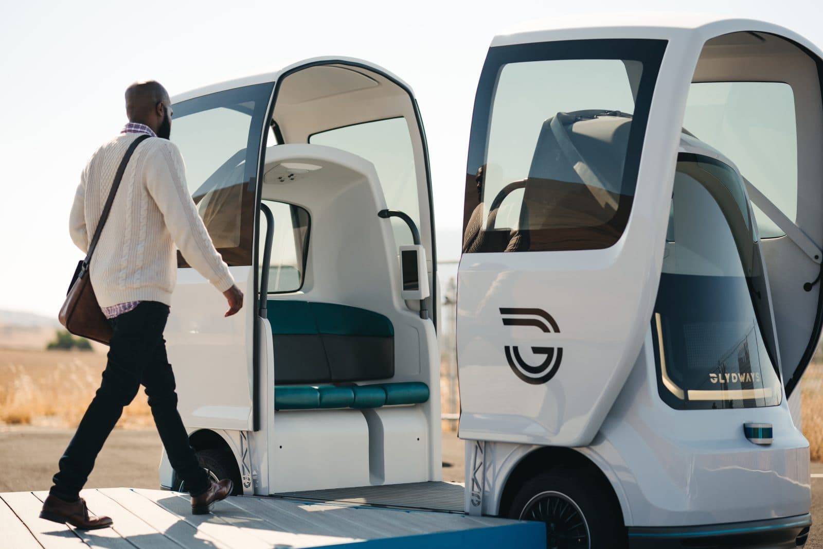 Image of a man boarding a Glydways car